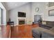 Bright living room with hardwood floors, fireplace, and vaulted ceilings at 5809 E Caley Dr, Centennial, CO 80111