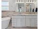 Main bath with double vanity, soaking tub, and marble at 5809 E Caley Dr, Centennial, CO 80111