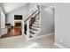 Elegant staircase with wrought iron balusters and hardwood treads at 5809 E Caley Dr, Centennial, CO 80111