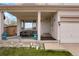 Cozy covered front porch featuring comfortable seating, potted plants, and decorative accents at 20292 E 47Th Ave, Denver, CO 80249