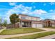 Inviting two-story home with a covered front porch, two-car garage, and landscaped lawn at 20292 E 47Th Ave, Denver, CO 80249