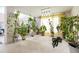 Spacious living room with an open railing, lots of plants, and neutral colored carpet at 20292 E 47Th Ave, Denver, CO 80249