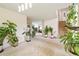 Inviting living room with neutral walls, plants, and views of the stairway at 20292 E 47Th Ave, Denver, CO 80249