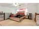 Spacious main bedroom featuring neutral carpet, a ceiling fan, and silver decorative furniture at 20292 E 47Th Ave, Denver, CO 80249