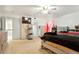 Bright main bedroom with light carpet, ceiling fan, and walk in closet, and sliding doors at 20292 E 47Th Ave, Denver, CO 80249