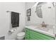 Stylish bathroom with a modern vanity, sink and round mirror at 290 W 12Th Ave # 303, Denver, CO 80204