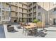 Community courtyard with furniture, plants, and views of upper level balconies at 290 W 12Th Ave # 303, Denver, CO 80204