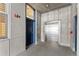 Hallway with elevator, blue door and concrete walls and flooring at 290 W 12Th Ave # 303, Denver, CO 80204