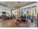 Modern living room with large windows and a balcony, offering plenty of natural light at 290 W 12Th Ave # 303, Denver, CO 80204