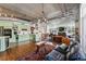 Spacious living area with an exposed ceiling, hardwood flooring and a charming fireplace at 290 W 12Th Ave # 303, Denver, CO 80204