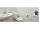 Modern bathroom with sleek fixtures, white vanity, and minimalist design at 21528 E 59Th Pl, Aurora, CO 80019