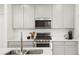 Modern kitchen with stainless steel appliances and sleek countertops at 21528 E 59Th Pl, Aurora, CO 80019