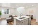 Open kitchen design with island seating and stainless steel dishwasher at 21528 E 59Th Pl, Aurora, CO 80019