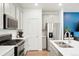 Well-equipped kitchen offering modern appliances and plenty of counter space at 21528 E 59Th Pl, Aurora, CO 80019