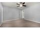 Empty bedroom with plush carpet, gray walls, and a ceiling fan at 4950 Homestead Pl # 23, Thornton, CO 80229