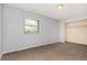 Bedroom with neutral carpet, light gray walls, and standard closet at 4950 Homestead Pl # 23, Thornton, CO 80229
