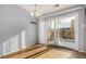 Dining room with wood floors and sliding glass doors leading to a patio at 4950 Homestead Pl # 23, Thornton, CO 80229
