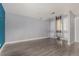 A spacious living room with a vibrant accent wall and stylish flooring at 4950 Homestead Pl # 23, Thornton, CO 80229