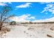 Scenic park view featuring snow-covered ground, walking paths, and covered picnic areas beneath a bright blue sky at 4950 Homestead Pl # 23, Thornton, CO 80229