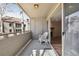 Balcony with outdoor seating offers a scenic view, adjacent to the living area with a fireplace at 23561 Genesee Village Road # C, Golden, CO 80401