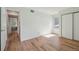 A clean bedroom with natural light, featuring a closet and leading to other rooms for easy access at 23561 Genesee Village Road # C, Golden, CO 80401
