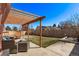 Outdoor enjoyment awaits on the patio under a pergola in a spacious backyard with privacy fence at 19228 E Arizona Pl, Aurora, CO 80017