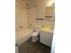 Cozy bathroom with a bathtub, vanity, and new vinyl flooring at 880 Orion Dr, Lafayette, CO 80026