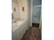 Bathroom featuring a vanity with sink and a shower/tub combo at 880 Orion Dr, Lafayette, CO 80026