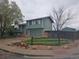 Charming two-story home with an attached garage and basketball hoop in the driveway at 880 Orion Dr, Lafayette, CO 80026