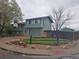 Charming two-story home with an attached garage and basketball hoop in the driveway at 880 Orion Dr, Lafayette, CO 80026
