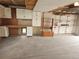 Garage view with built-in cabinets, pegboard organizers, workbench, and ample space for parking and storage at 880 Orion Dr, Lafayette, CO 80026