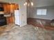 Open kitchen and dining area featuring wood cabinets and hardwood floors in the adjacent room at 880 Orion Dr, Lafayette, CO 80026