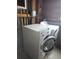 This laundry area showcases a side-by-side washer and dryer, providing convenient laundry solutions at home at 880 Orion Dr, Lafayette, CO 80026