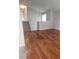 Living room featuring hardwood flooring, staircase, and bright, natural light at 880 Orion Dr, Lafayette, CO 80026