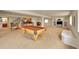 Large finished basement offering a pool table, kitchenette, and living area with built-ins at 9784 S Iris Ct, Littleton, CO 80127