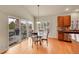 Dining area features a glass table with slider door access to an outdoor deck at 9784 S Iris Ct, Littleton, CO 80127