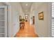 Hallway with light colored walls, hardwood flooring, and natural light at 9784 S Iris Ct, Littleton, CO 80127