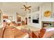 Spacious living room with built in shelves, a fireplace, and carpet flooring at 9784 S Iris Ct, Littleton, CO 80127