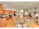 Open living space with a kitchen, dining area, living room, and staircase at 9784 S Iris Ct, Littleton, CO 80127