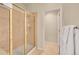 Shower with glass door and gold trim at 9784 S Iris Ct, Littleton, CO 80127