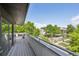 Balcony with a view of tree-lined street and modern buildings under a blue sky at 2898 W 22Nd Ave, Denver, CO 80211