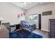 Cozy bedroom featuring a vaulted ceiling, floral bedding, and a dark blue rug at 2898 W 22Nd Ave, Denver, CO 80211