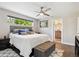 Comfortable bedroom with modern decor, a neutral palette, and an attached bathroom at 2898 W 22Nd Ave, Denver, CO 80211