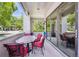 Charming covered patio with outdoor dining furniture and seamless access to the indoors at 2898 W 22Nd Ave, Denver, CO 80211