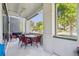 Outdoor covered patio with dining table, seating, and a grill at 2898 W 22Nd Ave, Denver, CO 80211
