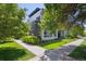 Corner lot home featuring a modern design with lush landscaping and a sidewalk at 2898 W 22Nd Ave, Denver, CO 80211
