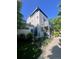 Modern home showcasing its architecture with greenery and a sidewalk at 2898 W 22Nd Ave, Denver, CO 80211