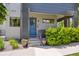 Inviting front entrance with a blue door, landscaped steps, and modern architectural details at 2898 W 22Nd Ave, Denver, CO 80211