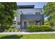 Contemporary home with a blue front door, modern landscaping, and a well-manicured lawn at 2898 W 22Nd Ave, Denver, CO 80211