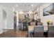 An open-concept kitchen with stainless steel appliances, a stylish island, and a dining area at 2898 W 22Nd Ave, Denver, CO 80211